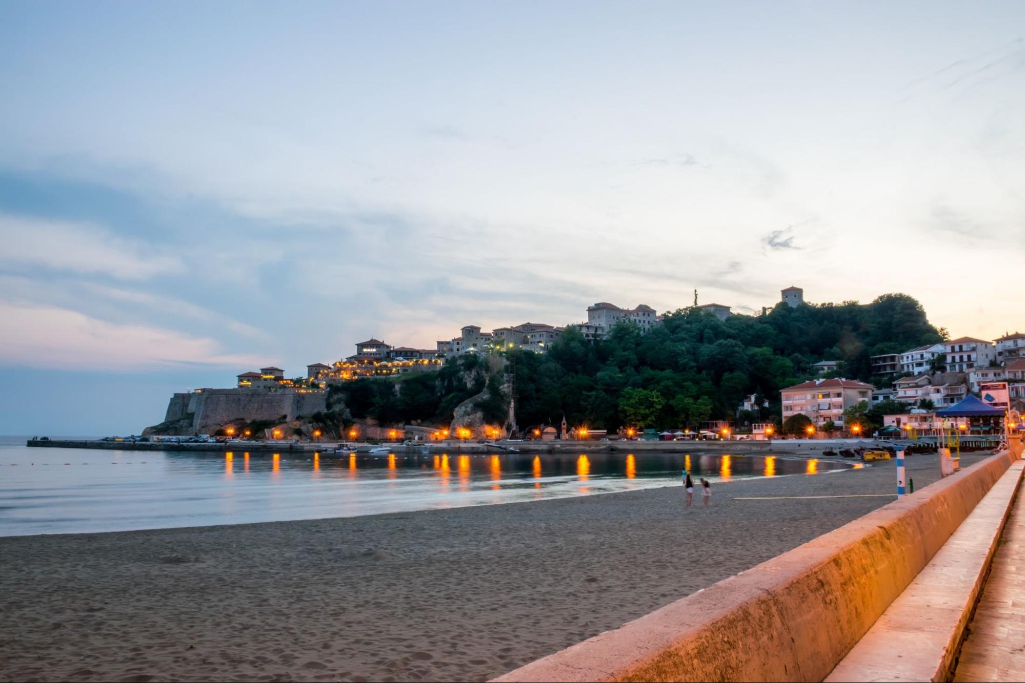 tourists went to the beach for a walk during sunset